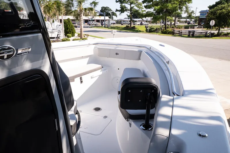 Slide: The Image of 2027 Sea Pro 262 Offshore boat interior with seating and helm, showcasing modern design. - 11