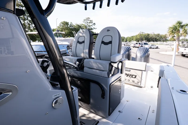 Slide: The Image of 2027 Sea Pro 262 Offshore boat interior with dual seats and modern controls. - 15