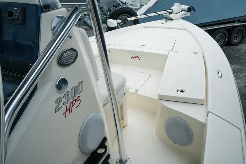 Slide: The Image of 2021 Pathfinder 2300 HPS boat interior with steering console and seating area. - 14