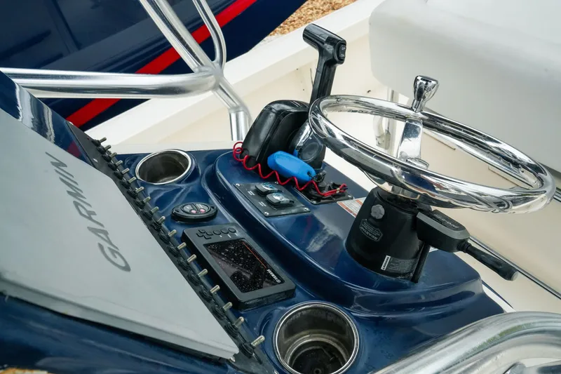 Slide: The Image of Steering console of 2021 Pathfinder 2300 HPS boat with Garmin navigation system. - 21