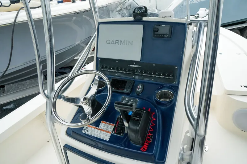 Slide: The Image of Control console of a 2021 Pathfinder 2300 HPS boat with Garmin navigation system. - 11