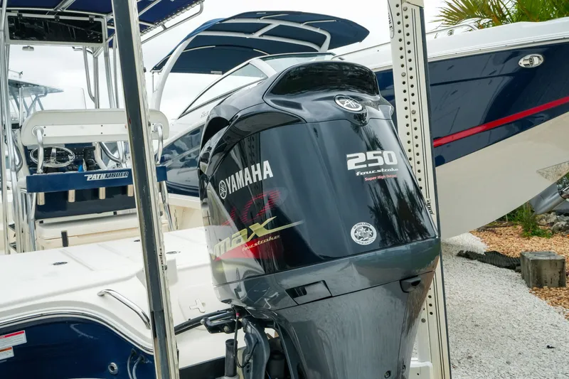 Slide: The Image of 2021 Pathfinder 2300 HPS boat with Yamaha 250 outboard motor in marina setting. - 4