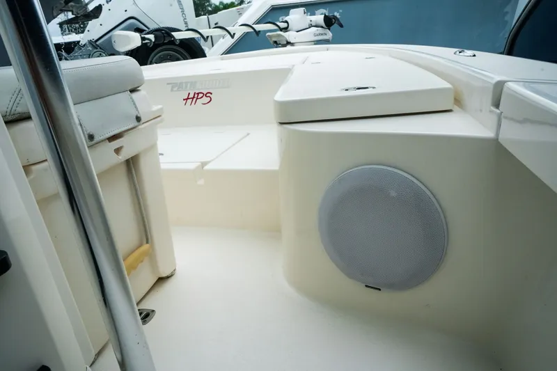 Slide: The Image of 2021 Pathfinder 2300 HPS boat interior with speaker and seating area. - 16