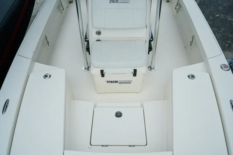 Slide: The Image of 2021 Pathfinder 2300 HPS boat interior with seating and storage compartments. - 18
