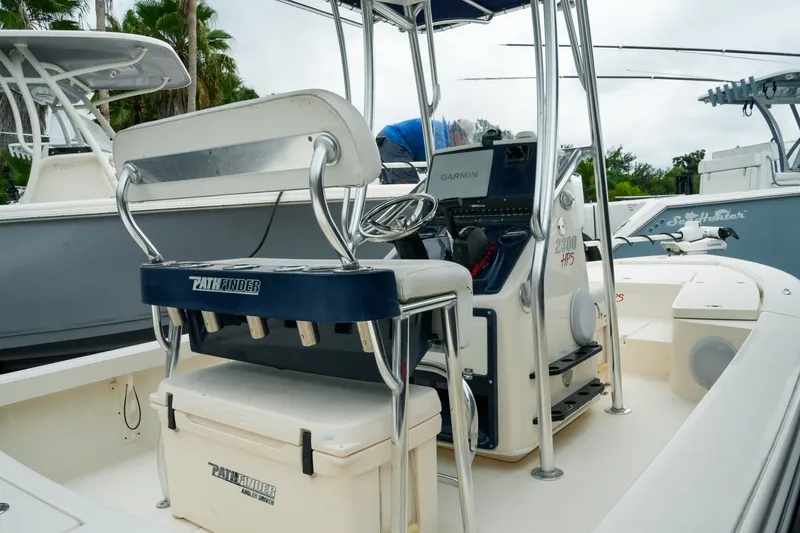 Slide: The Image of 2021 Pathfinder 2300 HPS boat interior with Garmin navigation system and seating. - 8