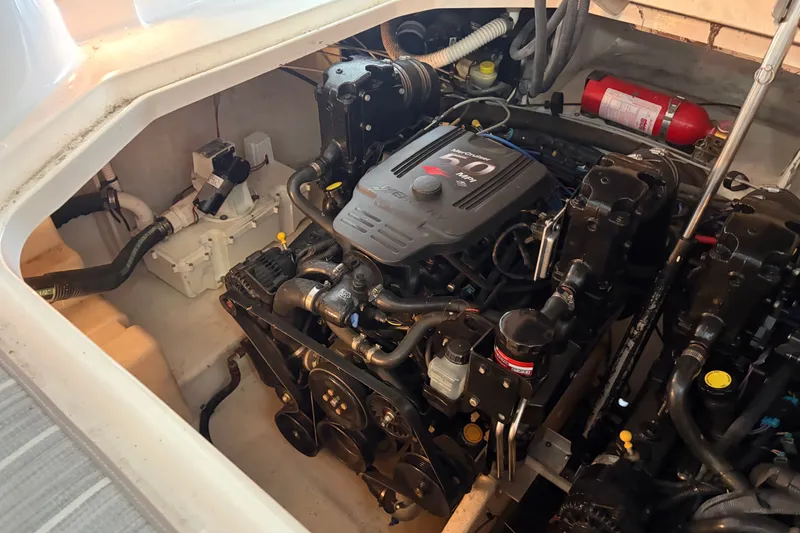 Slide: The Image of Engine compartment of a 2006 Sea Ray 290 Sundancer boat, featuring a MerCruiser engine. - 27