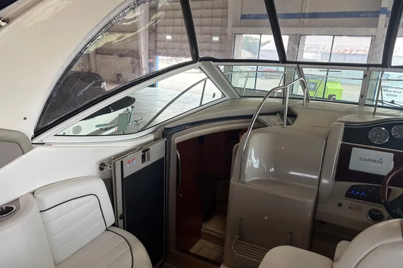 Slide: The Image of Interior view of a 2006 Sea Ray 290 Sundancer boat with Garmin navigation system. - 10
