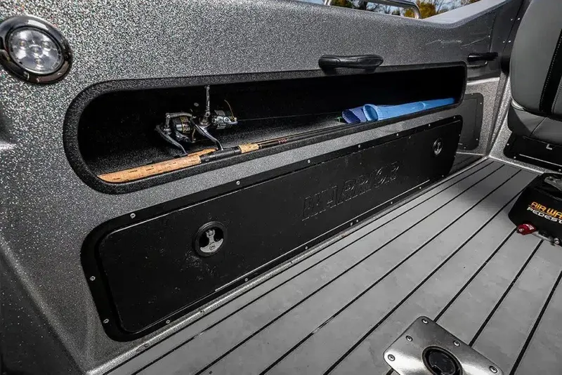 Slide: The Image of Interior of 2027 Warrior V208 boat with fishing rod storage and sleek design. - 14