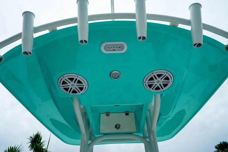 Slide: The Image of Underside view of 2027 Pathfinder 2500 Tournament boat with speakers and rod holders. - 13