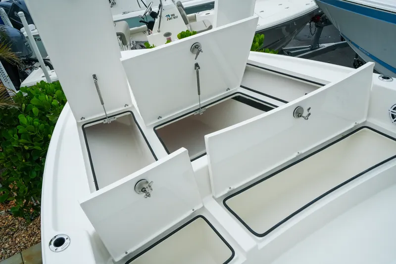 Slide: The Image of 2027 Pathfinder 2500 Tournament boat with open storage compartments on deck. - 25