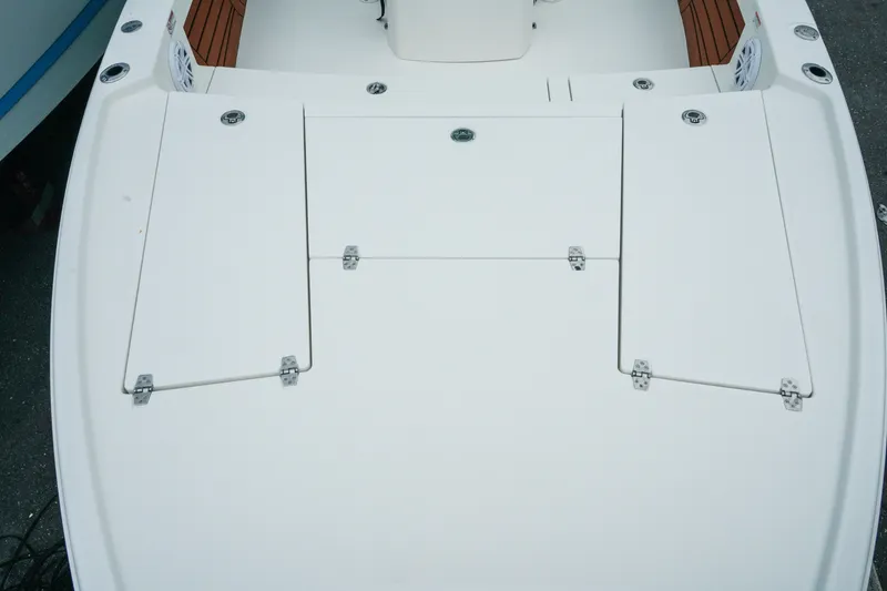 Slide: The Image of Bow deck of 2027 Pathfinder 2500 Tournament boat with storage compartments. - 26