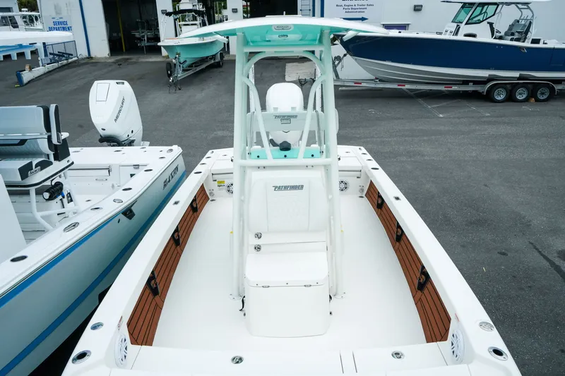 Slide: The Image of 2027 Pathfinder 2500 Tournament boat in a dealership lot, showcasing sleek design and features. - 28