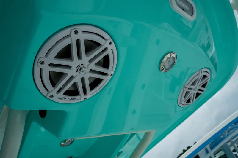 Slide: The Image of 2027 Pathfinder 2500 Tournament boat with JL Audio speakers on turquoise hull. - 20
