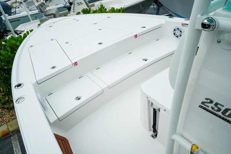 Slide: The Image of 2027 Pathfinder 2500 Tournament boat deck with storage compartments and seating. - 22