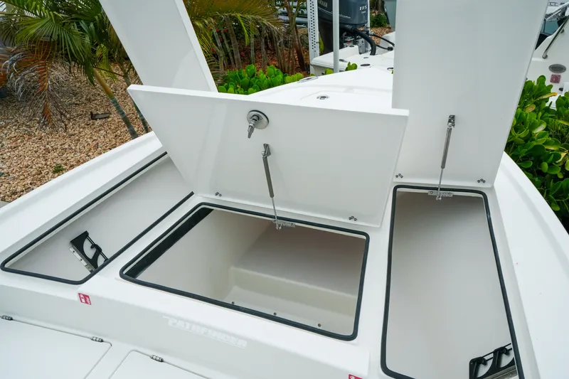 Slide: The Image of Open storage compartments on a 2027 Pathfinder 2500 Tournament boat deck. - 24