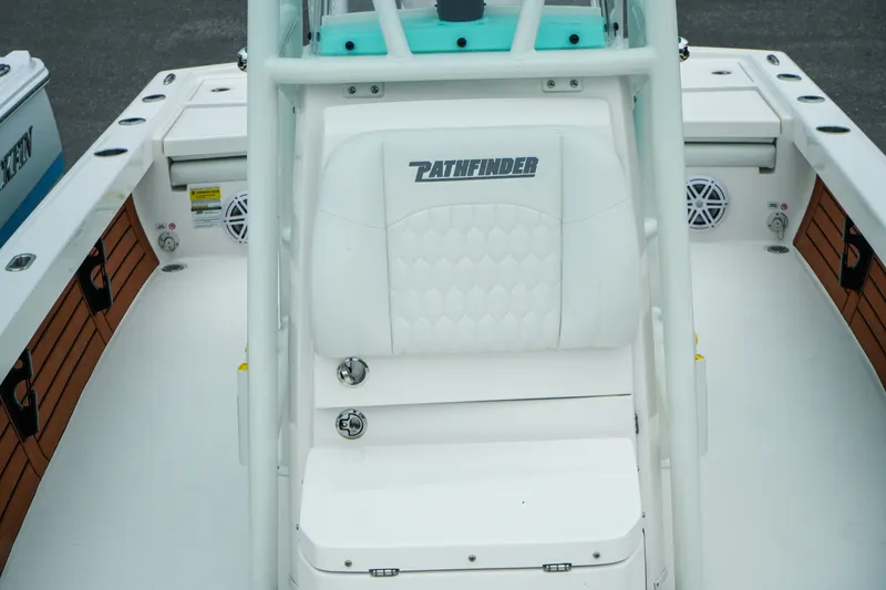 Slide: The Image of 2027 Pathfinder 2500 Tournament boat interior with white seating and wood accents. - 30