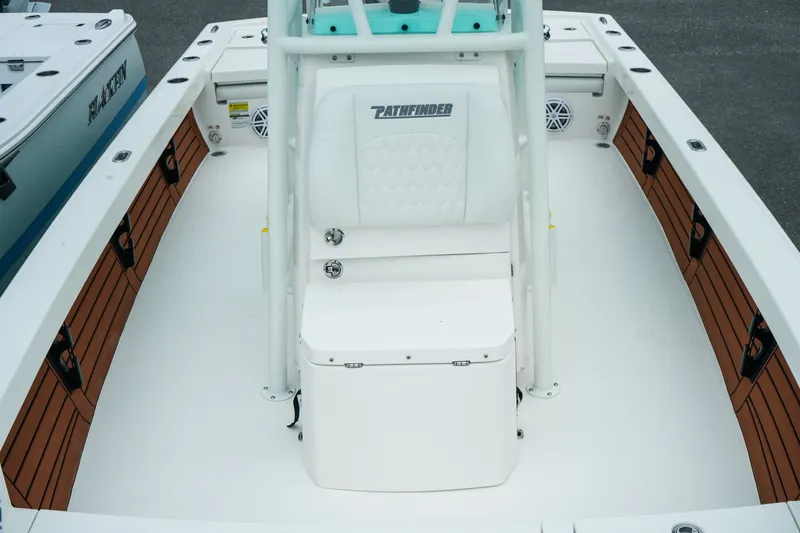 Slide: The Image of 2027 Pathfinder 2500 Tournament boat interior with white seating and wood accents. - 29