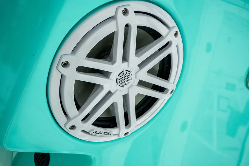 Slide: The Image of White JL Audio speaker on turquoise Pathfinder 2500 Tournament boat, 2027 model. - 21