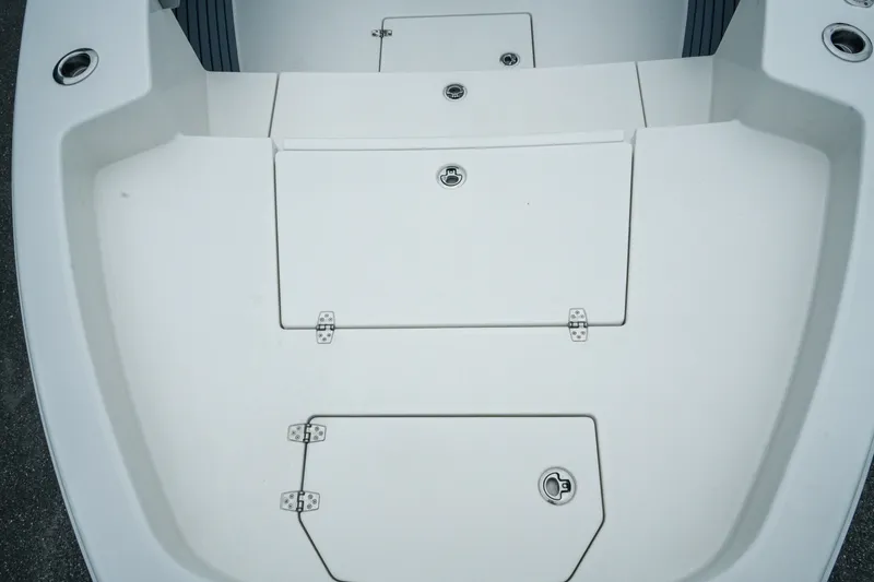 Slide: The Image of 2027 Pathfinder 2700 Tournament boat deck with storage compartments and sleek design. - 32