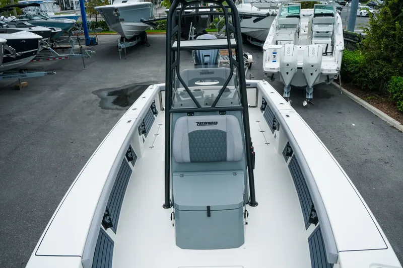 Slide: The Image of 2027 Pathfinder 2700 Tournament boat displayed in a marina, showcasing sleek design and seating. - 34