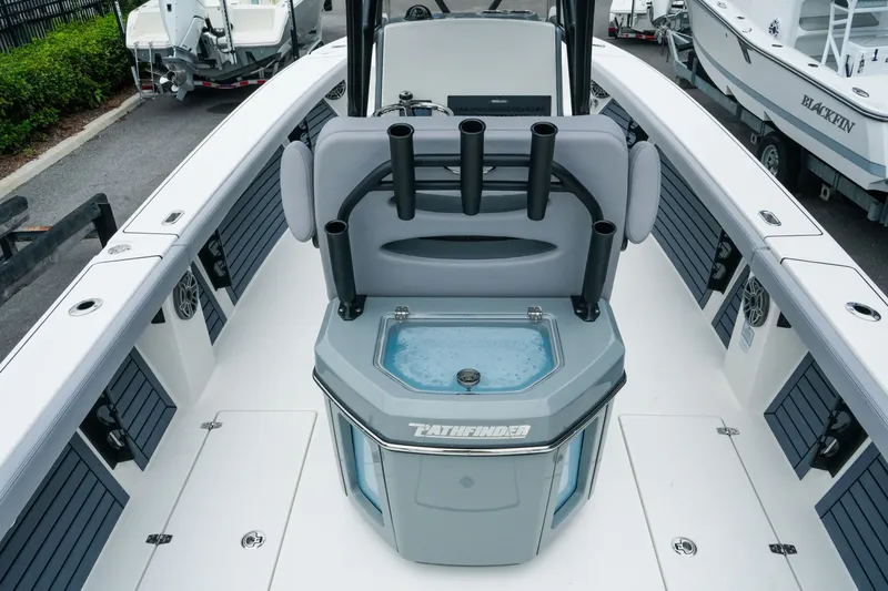 Slide: The Image of 2027 Pathfinder 2700 Tournament boat interior with rod holders and livewell. - 18
