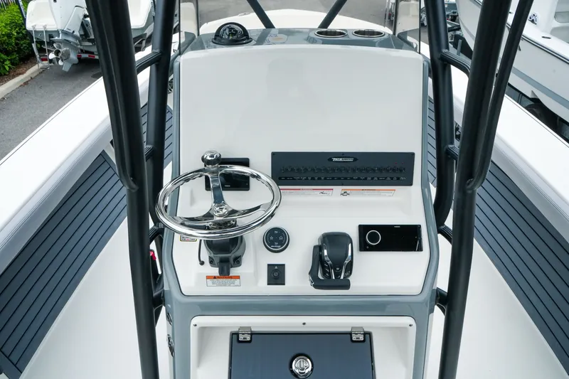 Slide: The Image of Center console of a 2027 Pathfinder 2700 Tournament boat with steering wheel and controls. - 26
