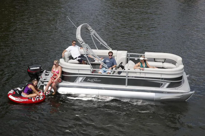 Slide: The Image of Manufacturer Provided Image: 2021 SunChaser Vista 20 LR pontoon boat with people enjoying water activities. - 1