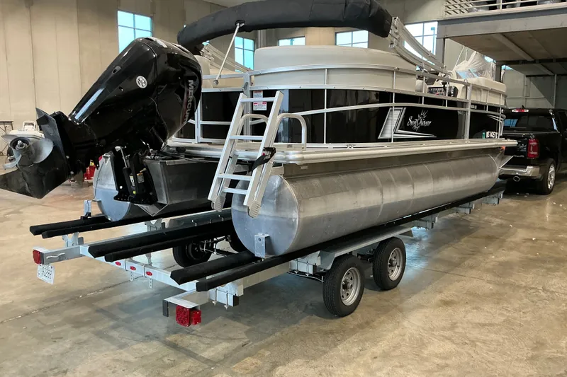Slide: The Image of 2021 SunChaser Vista 20 LR pontoon boat on trailer in indoor storage facility. - 16