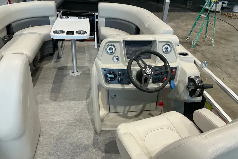 Slide: The Image of Interior of 2021 SunChaser Vista 20 LR pontoon boat with steering console and seating. - 20
