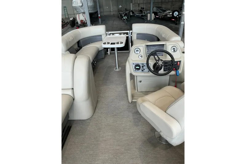 Slide: The Image of Interior of 2021 SunChaser Vista 20 LR pontoon boat with plush seating and steering console. - 26