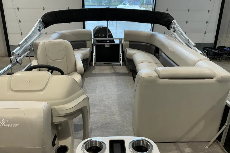 Slide: The Image of 2021 SunChaser Vista 20 LR pontoon boat interior with plush seating and modern design. - 18