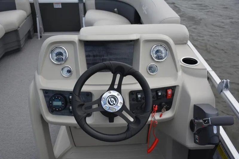 Slide: The Image of Manufacturer Provided Image: 2021 SunChaser Vista 20 LR boat dashboard with steering wheel and control panel. - 8