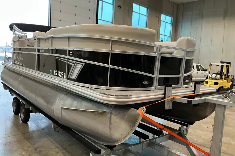 Slide: The Image of 2021 SunChaser Vista 20 LR pontoon boat in a warehouse setting. - 14