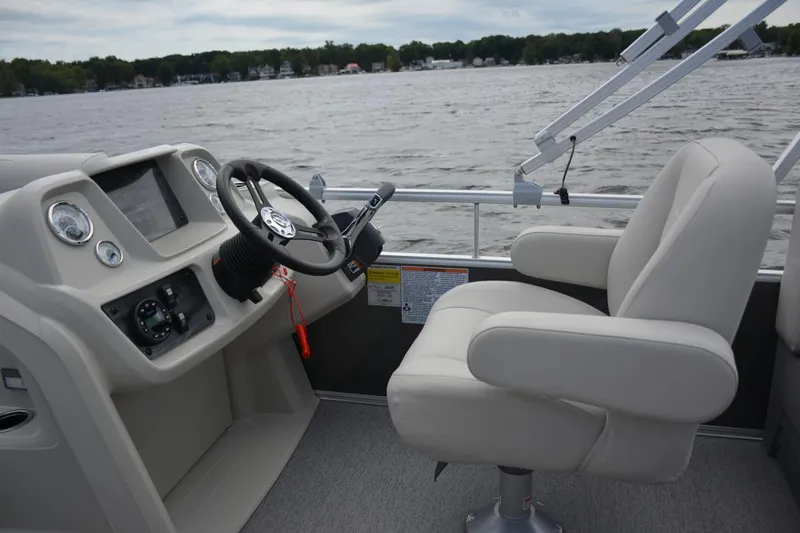 Slide: The Image of Manufacturer Provided Image: 2021 SunChaser Vista 20 LR boat interior with steering wheel and captain's chair. - 7