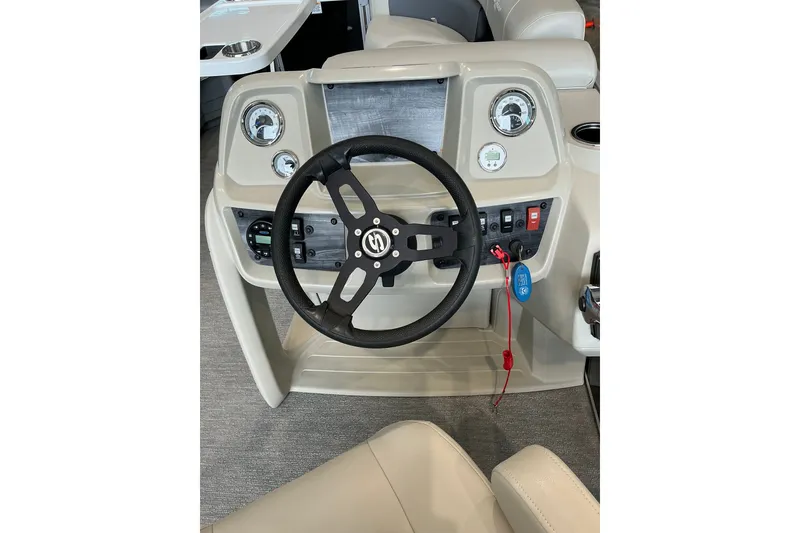 Slide: The Image of Steering console of 2021 SunChaser Vista 20 LR boat with gauges and controls. - 25