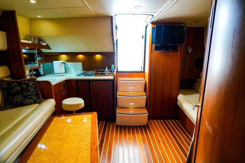 Slide: The Image of Luxurious interior of 2005 Tiara Yachts 3800 Open with wood finishes and modern amenities. - 32