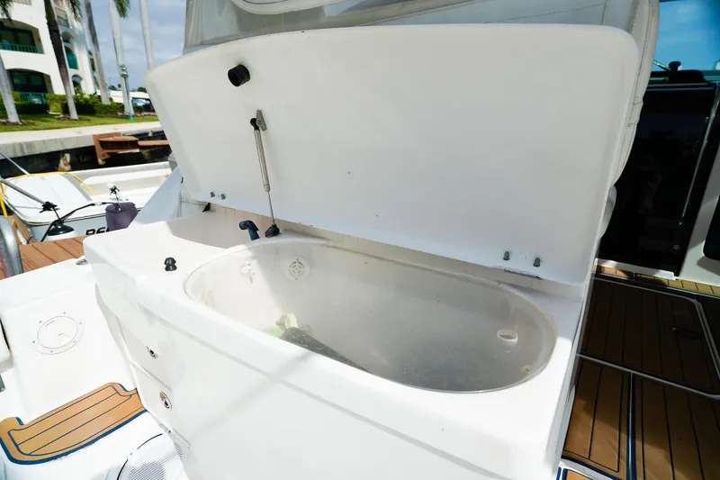 Slide: The Image of Open storage compartment on 2005 Tiara Yachts 3800 Open boat deck. - 14