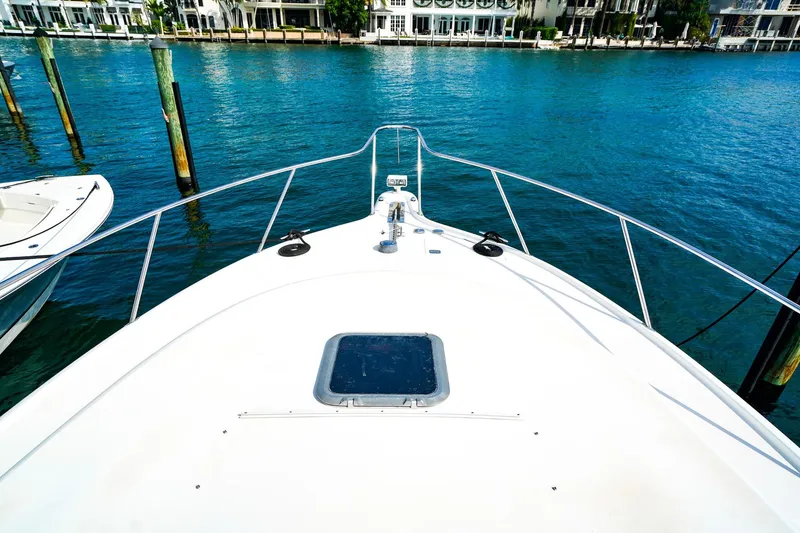 Slide: The Image of Bow view of 2005 Tiara Yachts 3800 Open on clear blue water. - 36