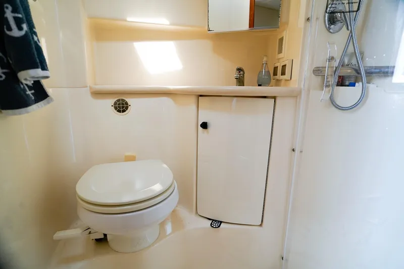 Slide: The Image of Bathroom interior of 2005 Tiara Yachts 3800 Open, featuring toilet and shower. - 33
