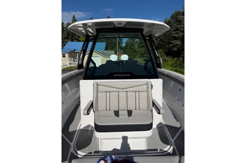 Slide: The Image of 2027 Monterey Elite 30 OB boat interior with cushioned seating and modern design. - 23