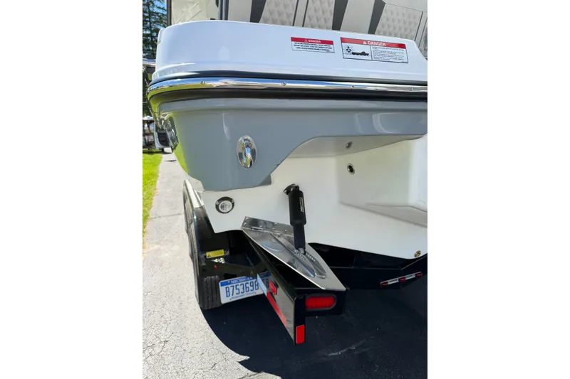 Slide: The Image of Rear view of 2027 Monterey Elite 30 OB boat on trailer, showcasing hull and trim details. - 2