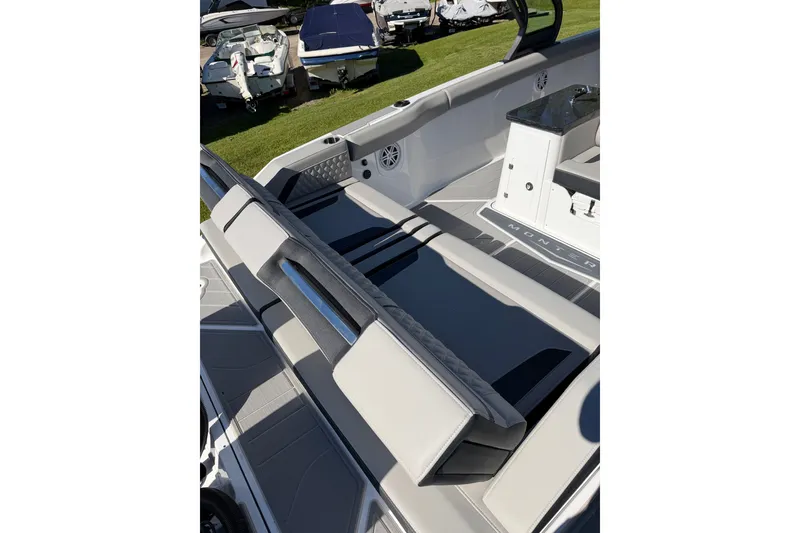 Slide: The Image of 2027 Monterey Elite 30 OB boat interior with sleek seating and modern design. - 7