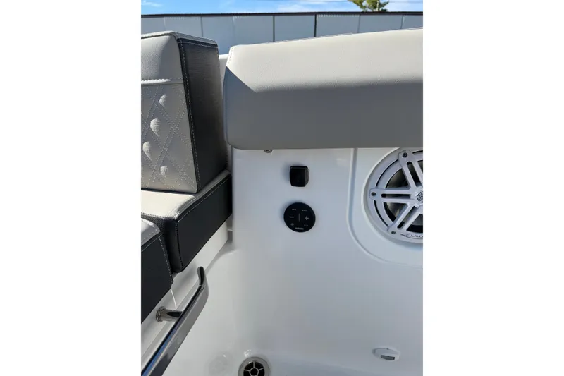 Slide: The Image of Interior of 2027 Monterey Elite 30 OB boat featuring speaker and seating details. - 16