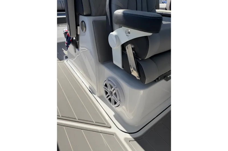 Slide: The Image of 2027 Monterey Elite 30 OB boat interior with sleek seating and integrated speaker system. - 19