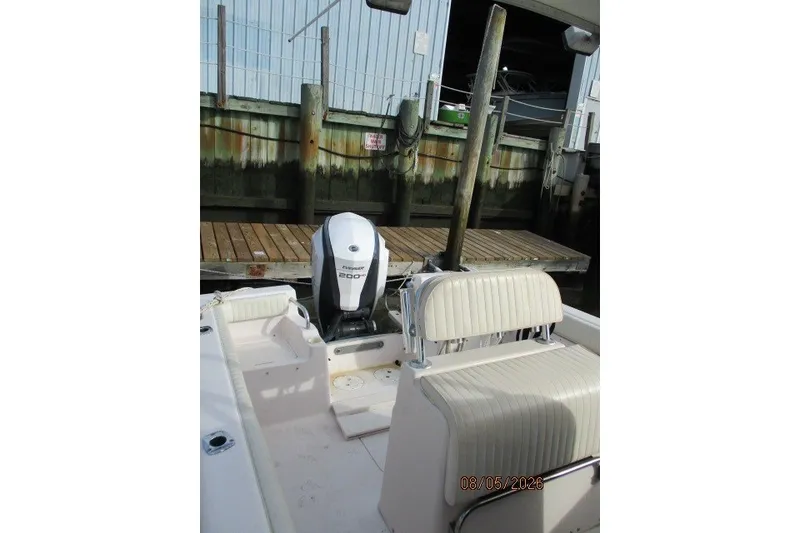 Slide: The Image of 2000 Grady-White Escape 209 boat with Yamaha engine docked at marina. - 51