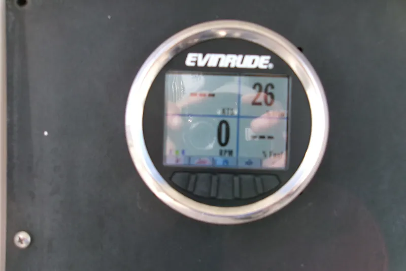 Slide: The Image of Evinrude digital gauge on 2000 Grady-White Escape 209 boat dashboard. - 29