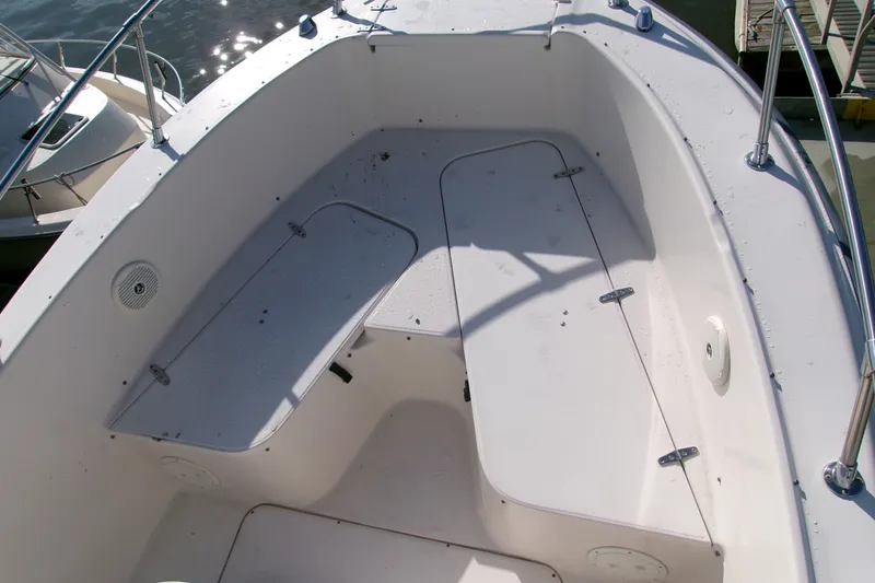 Slide: The Image of 2000 Grady-White Escape 209 boat interior with storage compartments and railing. - 36