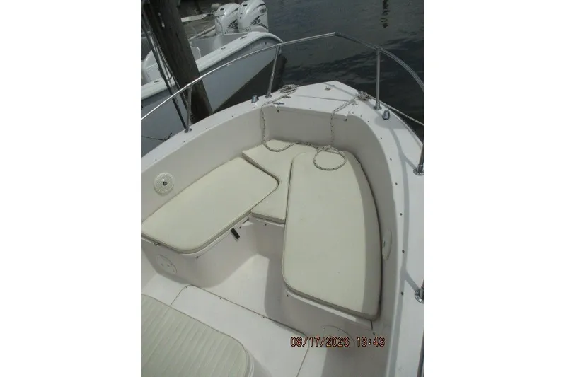 Slide: The Image of 2000 Grady-White Escape 209 boat interior with cushioned seating. - 32