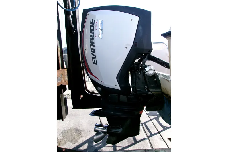 Slide: The Image of Evinrude E-TEC outboard motor on 2000 Grady-White Escape 209 boat. - 13