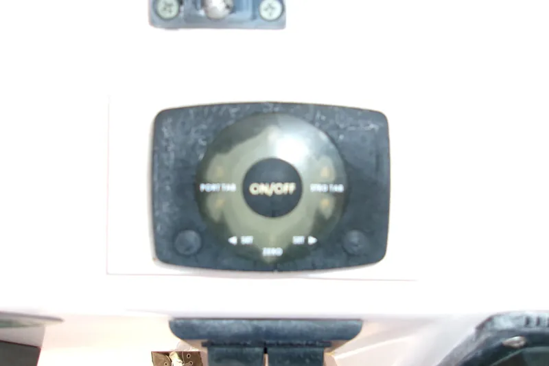 Slide: The Image of Control panel of a 2000 Grady-White Escape 209 boat, featuring an on/off switch. - 7